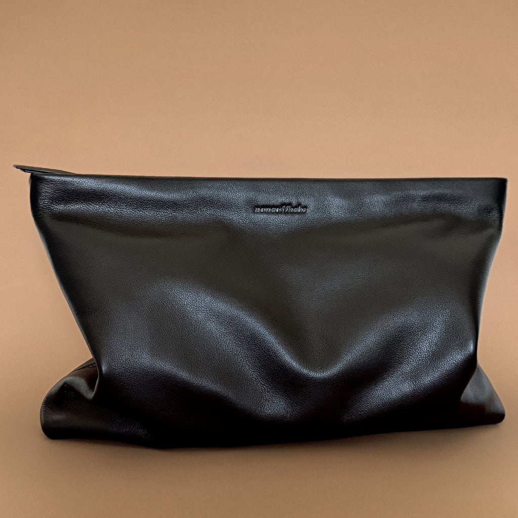 Muse minimalist leather pouch with clean silhouette in soft leather