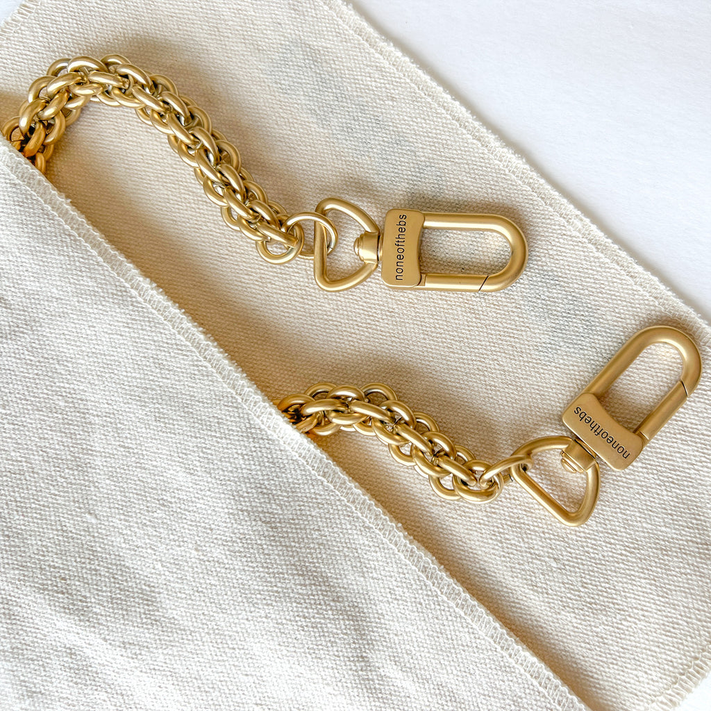 Veil matte gold leather shoulder strap with subtle metallic finish